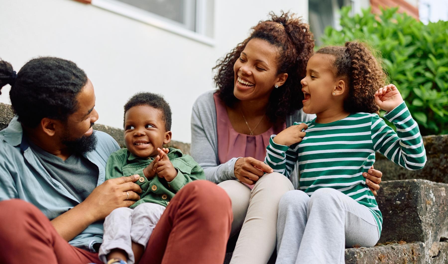 The essence of exceptional living a group of people sitting on a stone ledge